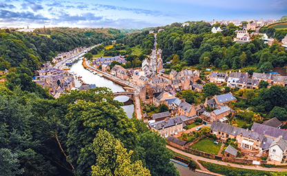European city along a river at dusk